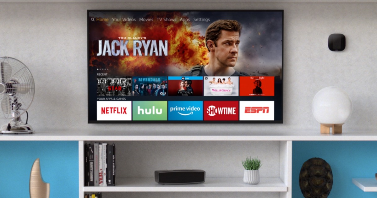 living room with large TV playing Fire TV streaming stick