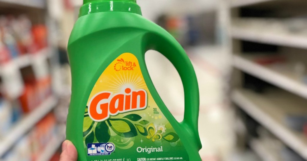 hand holding bottle of Gain laundry detergent