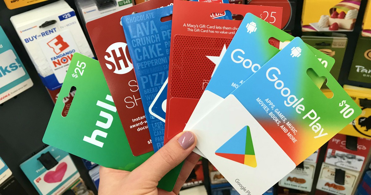 Hand holding a variety of gift cards