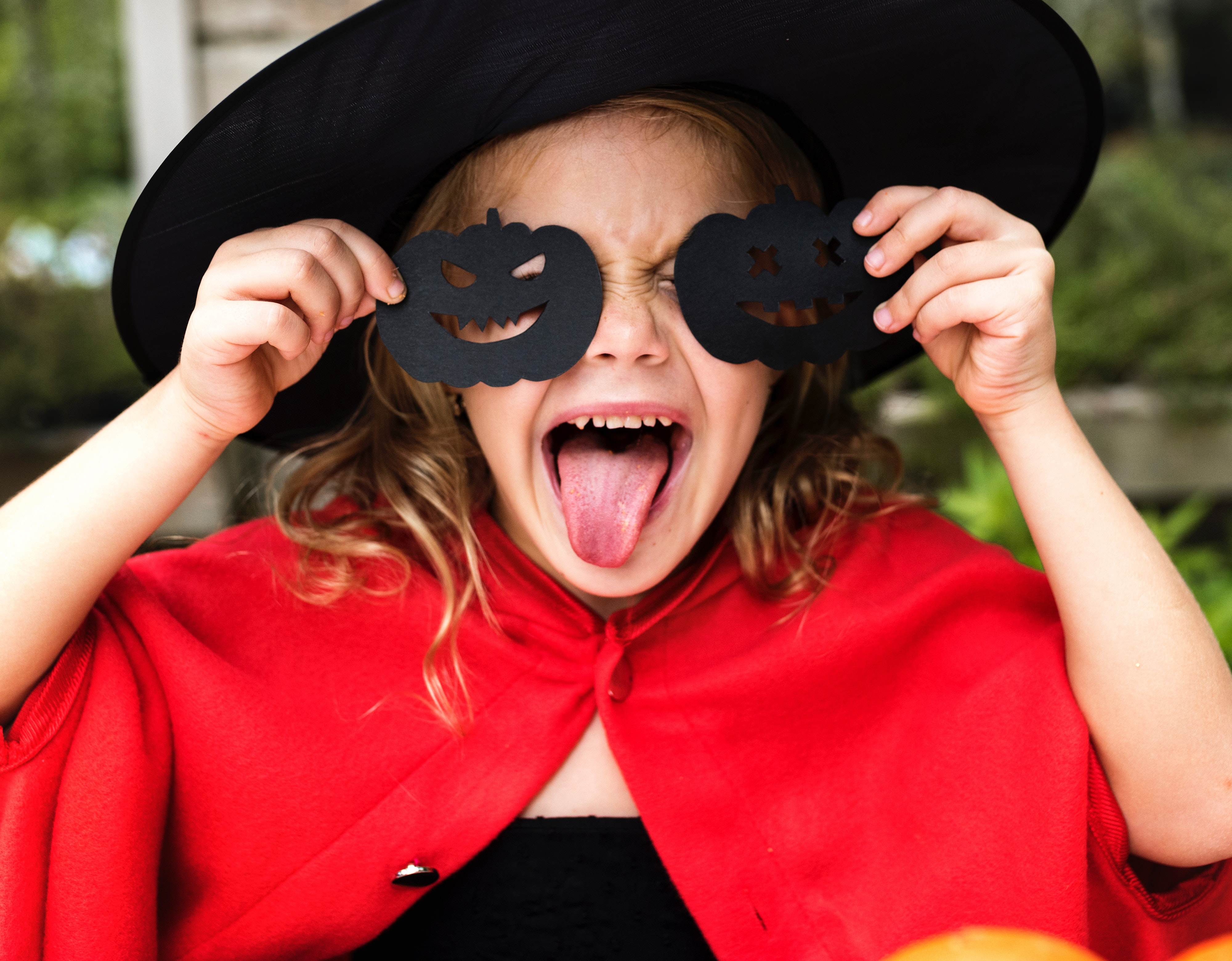 Halloween freebies and deals – girl dressed as a witch