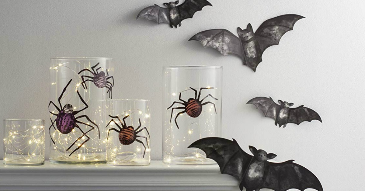 bats, candles & spider decor on shelf