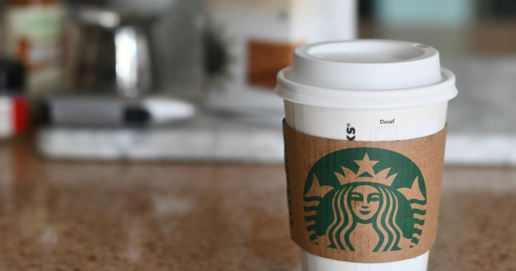 close up of starbucks to go cup on kitchen counter