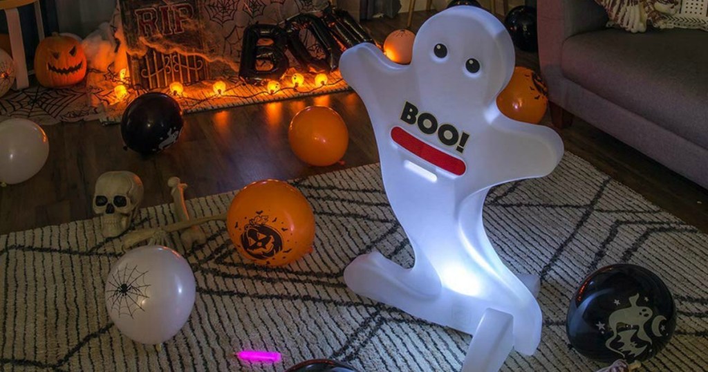 Step2 Kid Alert Ghost at night lighting up near Halloween decorations