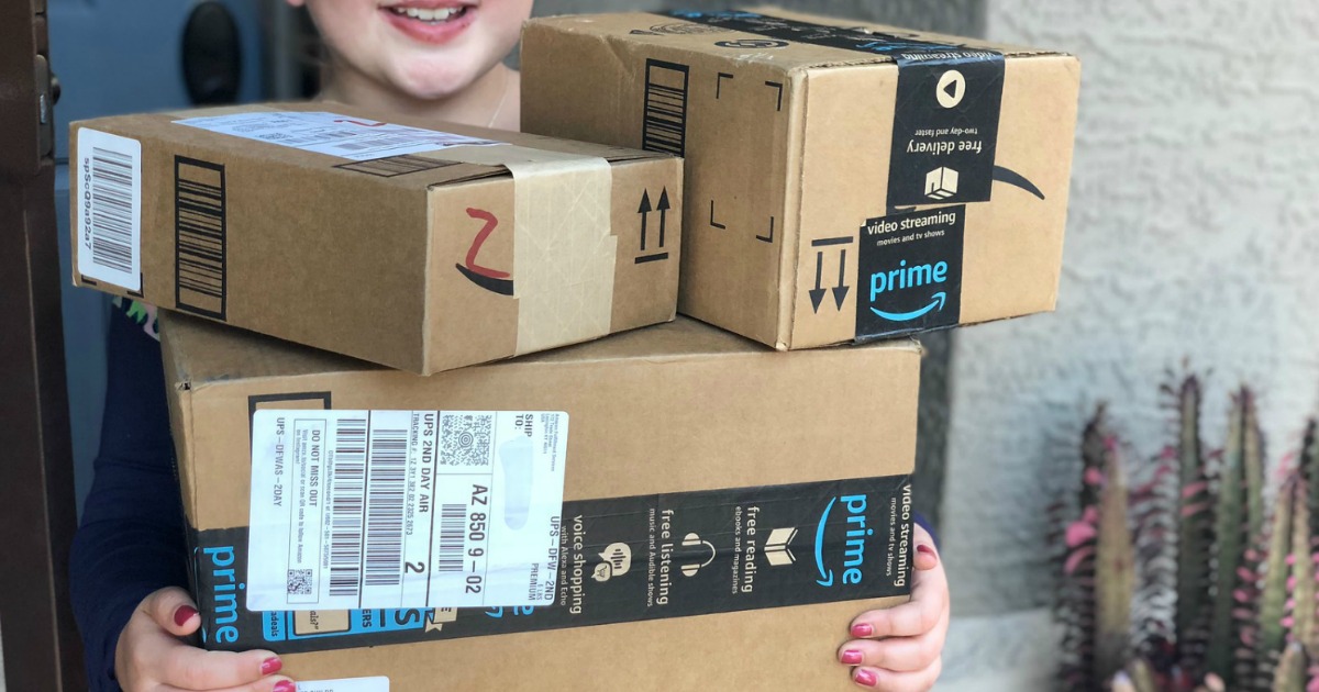 girl holding Amazon Packages