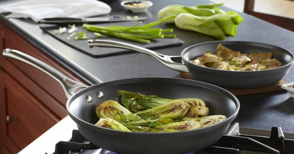 Calphalon Contemporary Nonstick 10" & 12" Omelette Pan Set with pan seared bok choy on stove and green onions on cutting board