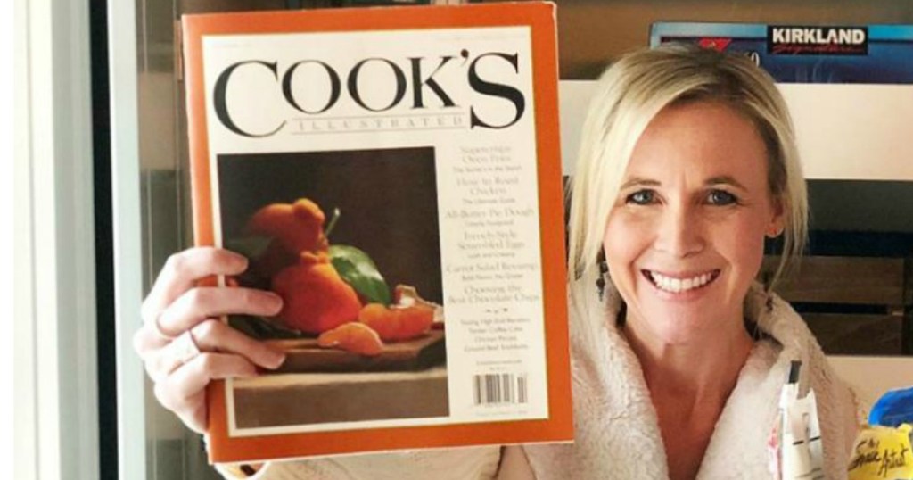 woman with blonde hair holding up copy of Cooks Illustrated