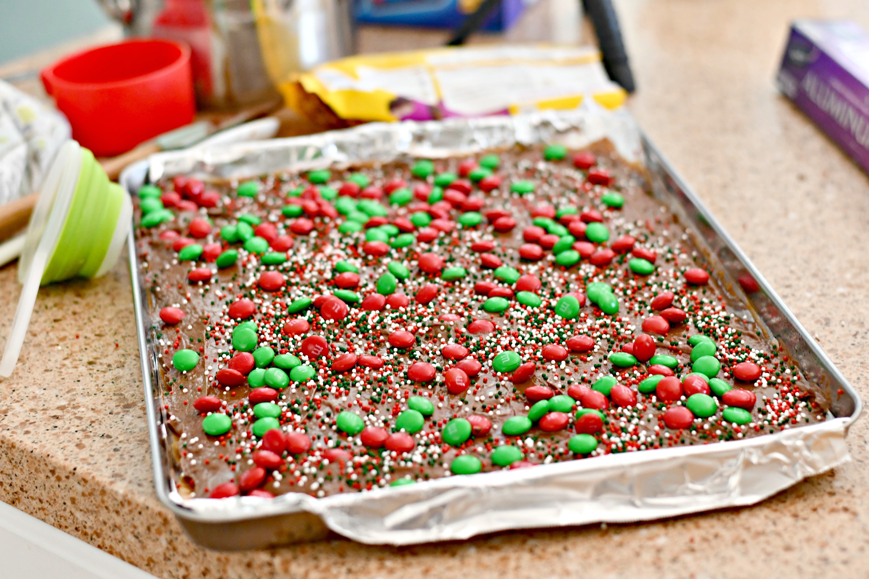 homemade christmas crack toffee – after adding M&M candies and sprinkles in the pan