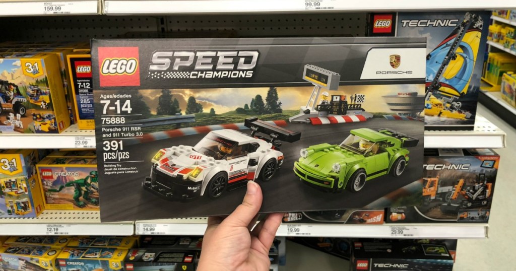 LEGO Speed Champions Porsche 911 RSR and 911 Turbo 3.0 box being held in store