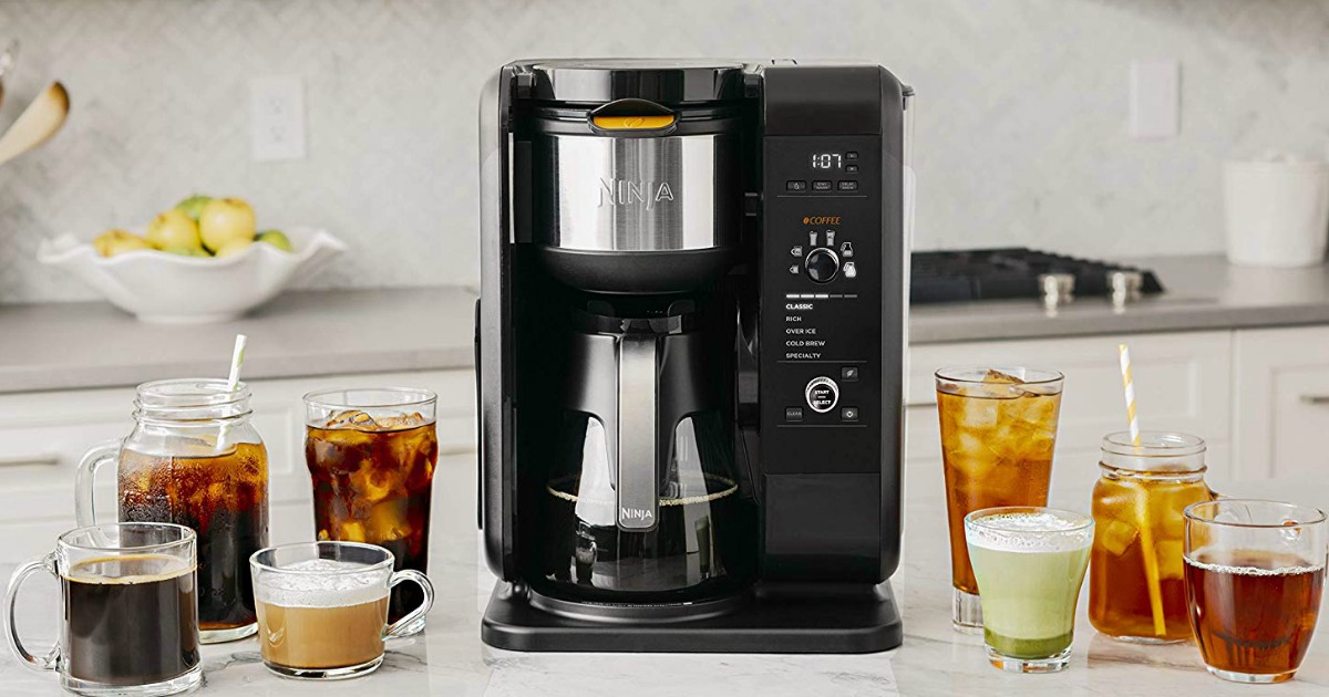 Ninja Hot & Cold Brewed System Coffee Maker on counter with various iced and hot coffees and teas
