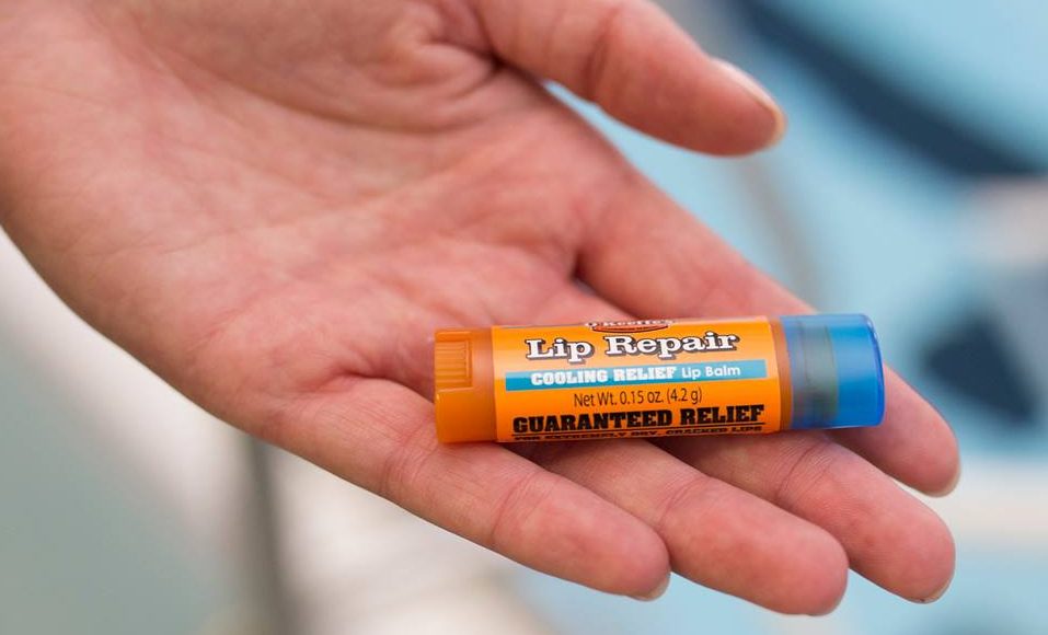 O'Keeffe's Cooling Relief lip balm in an open hand