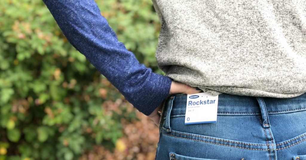 collin wearing rockstar jeans outside with hand on hip
