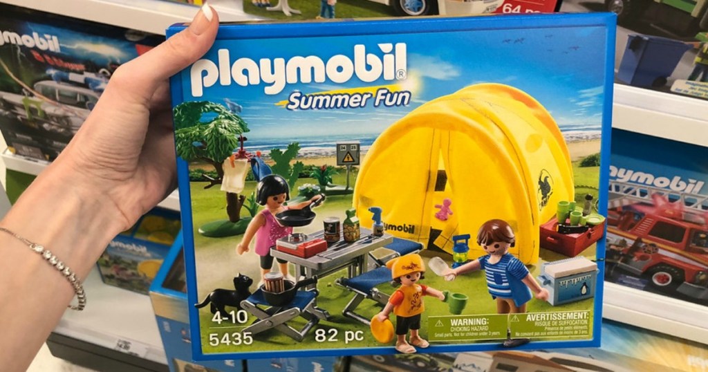 hand holding Playmobil camping tent set in box