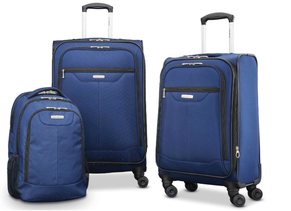 three pieces of blue luggage