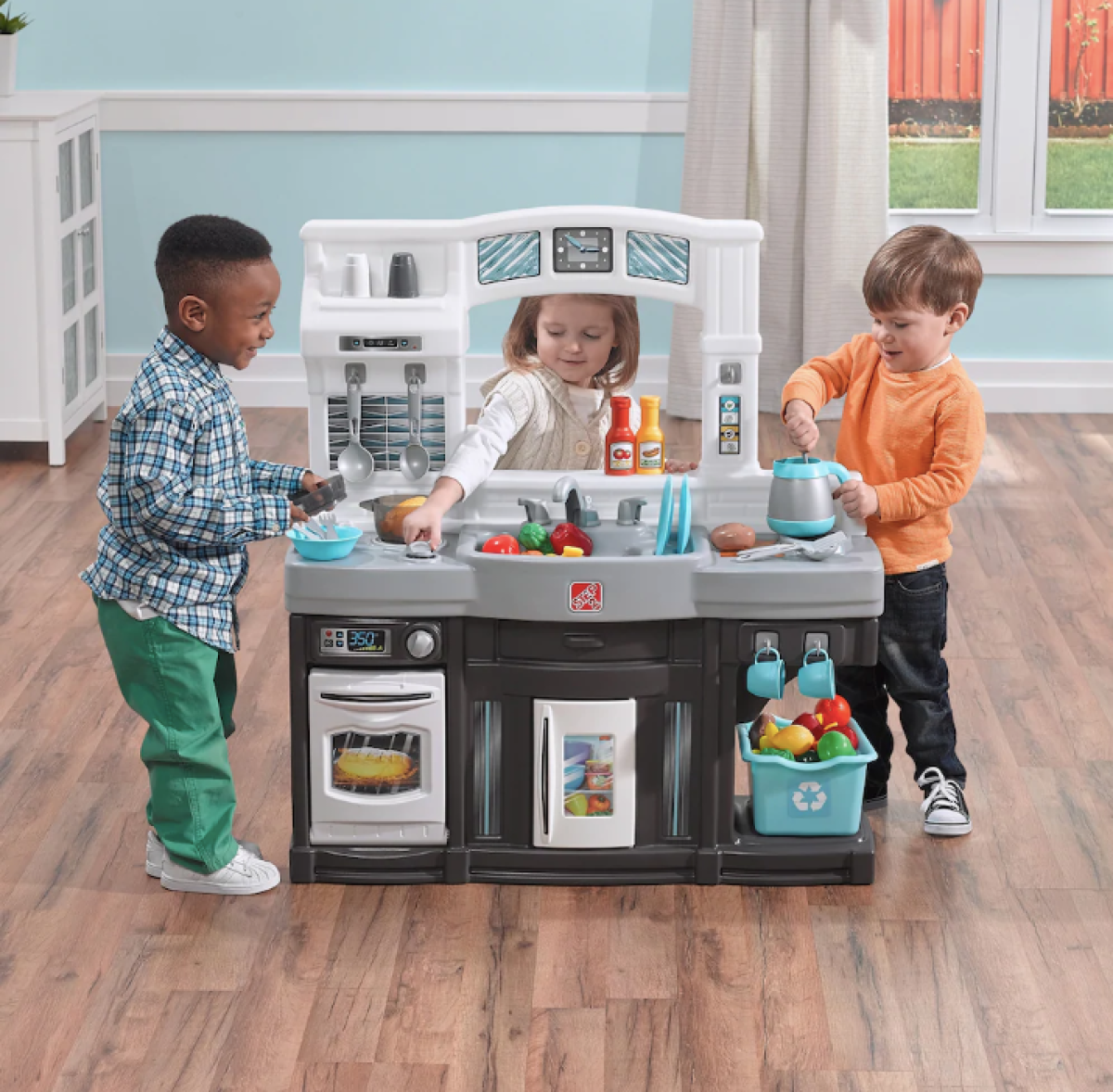 Step2 play kitchen with kids playing