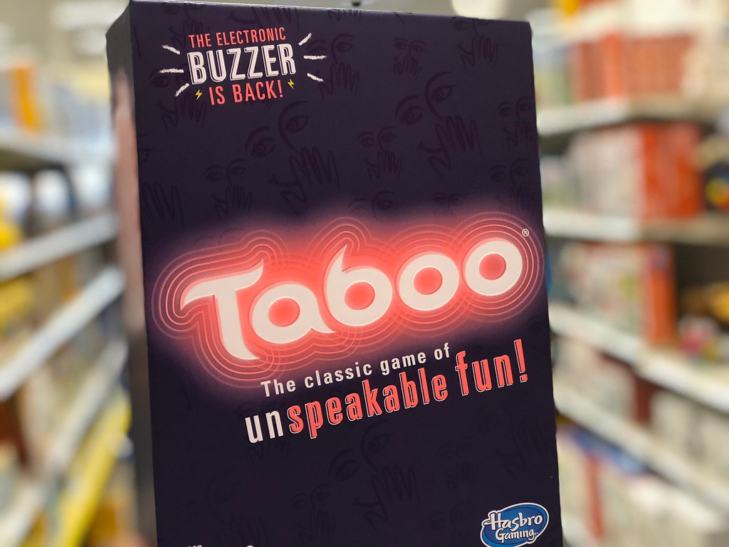 holding Taboo board game in the box