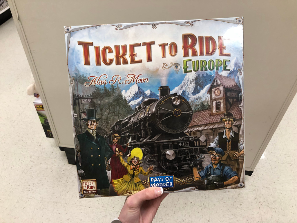 Hand holding Ticket To Ride - Europe game