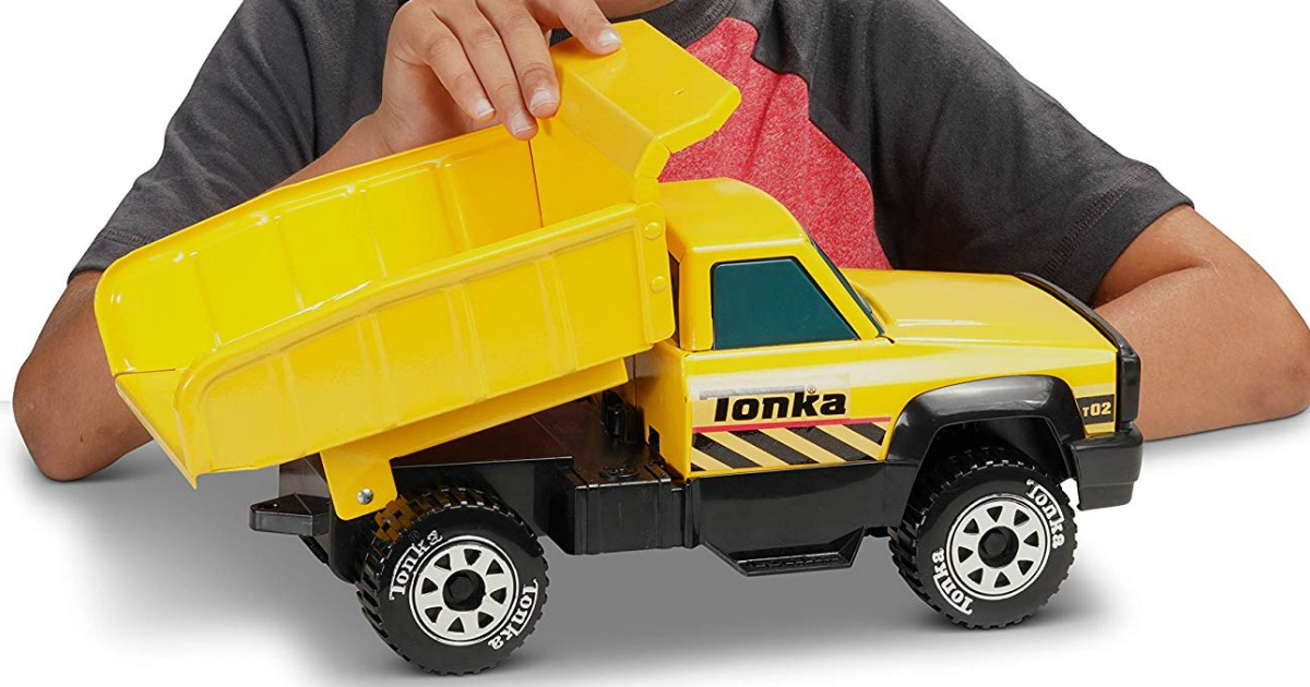 boy playing with Funrise Tonka Dump Truck