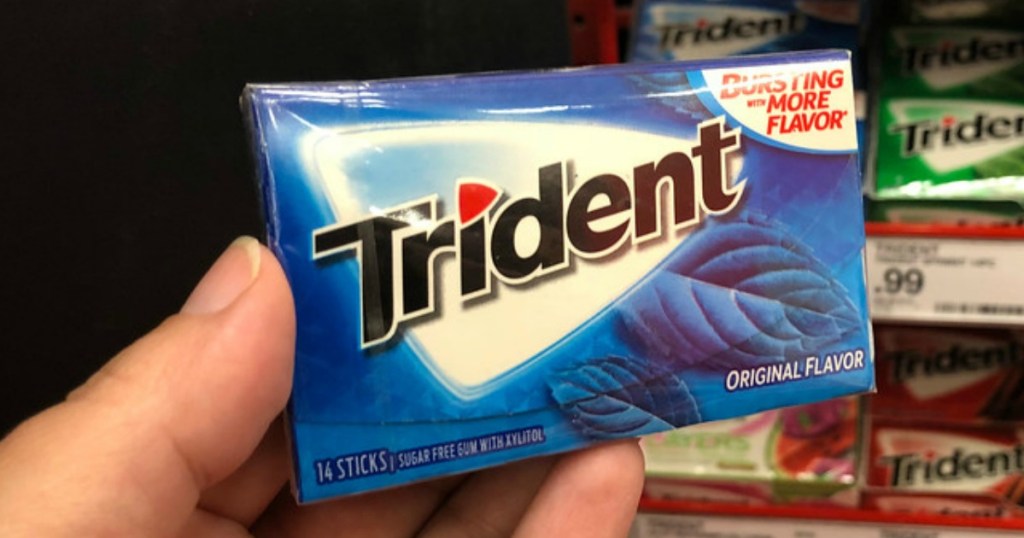 Hand dolding Trident gum