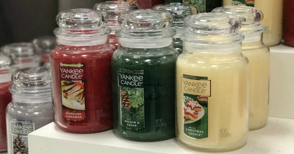 large jar candles on display in store
