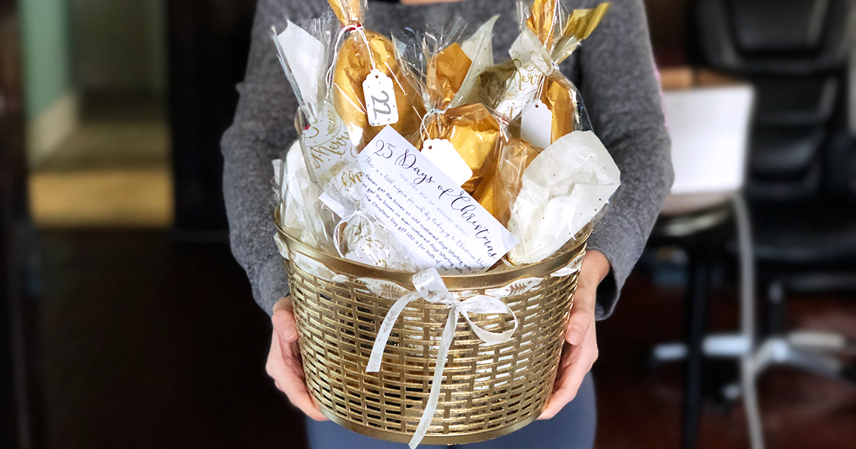woman holding diy advent calendar with gold basket 