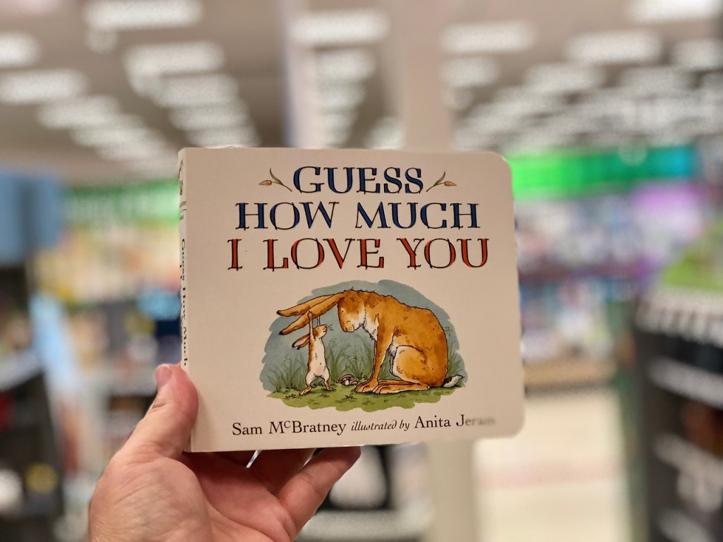 hand holding Guess How Much I Love You board book