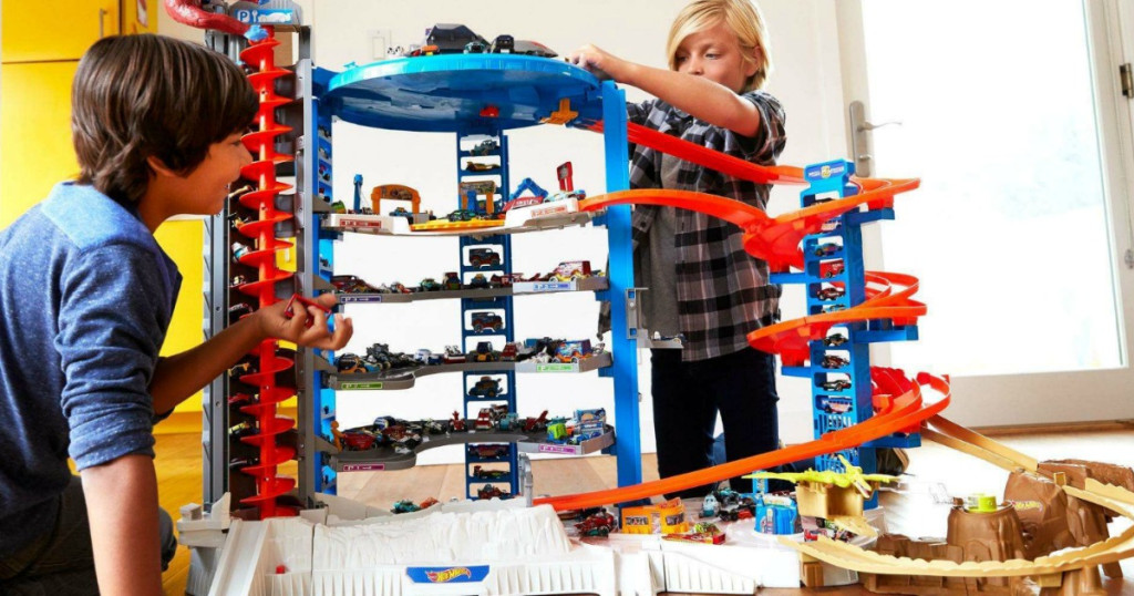 boys playing with a Hot Wheels set