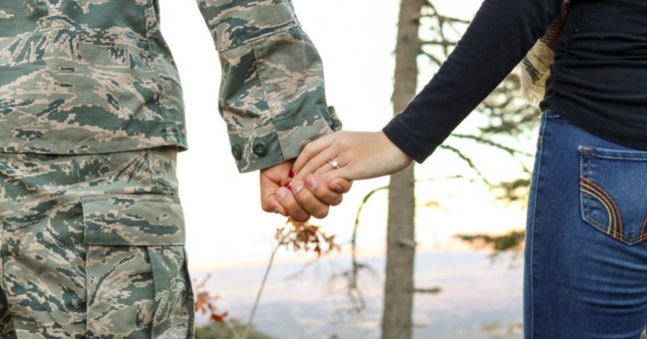 military spouses holding hands perhaps after using a military discount