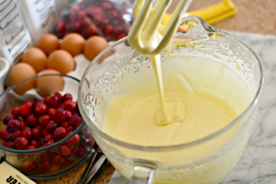 mixing eggs and sugar in a batter bowl