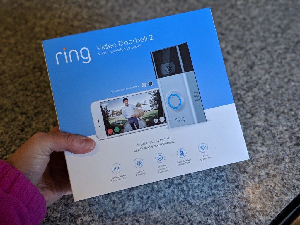 hand holding box of Ring Video Doorbell 2