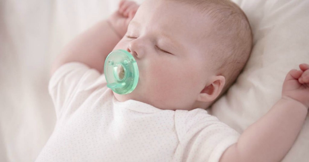 baby using avent pacifier
