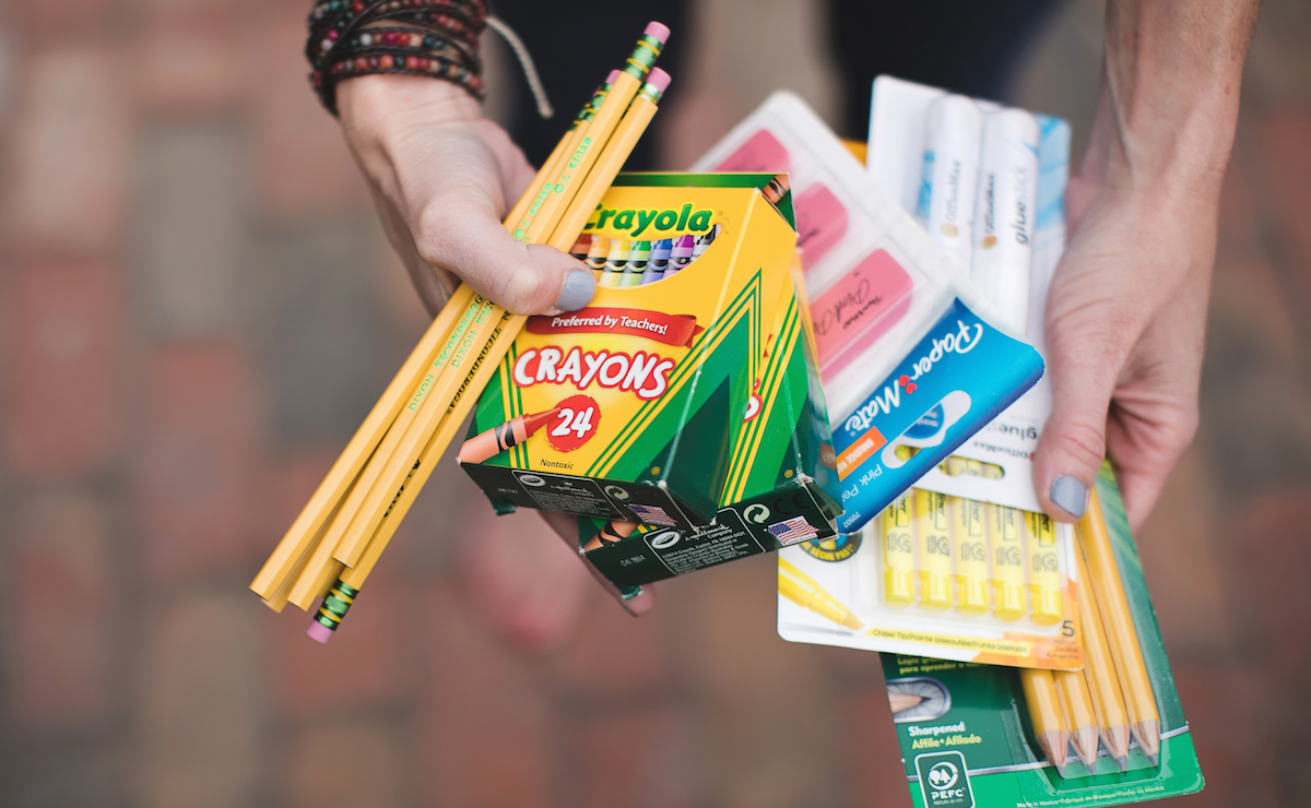simple thoughtful ways to pay-it-forward in the new year – Collin with school supplies