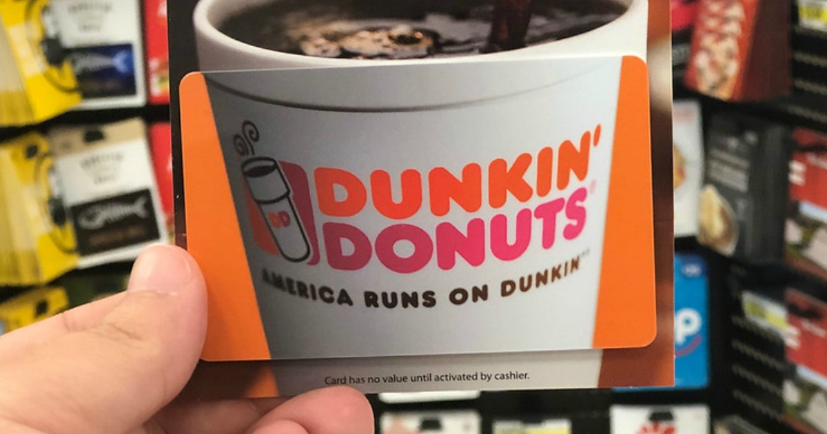 hand holding up a dunkin donuts gift card