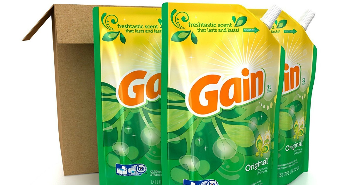 three pouches of Gain detergent next to a box