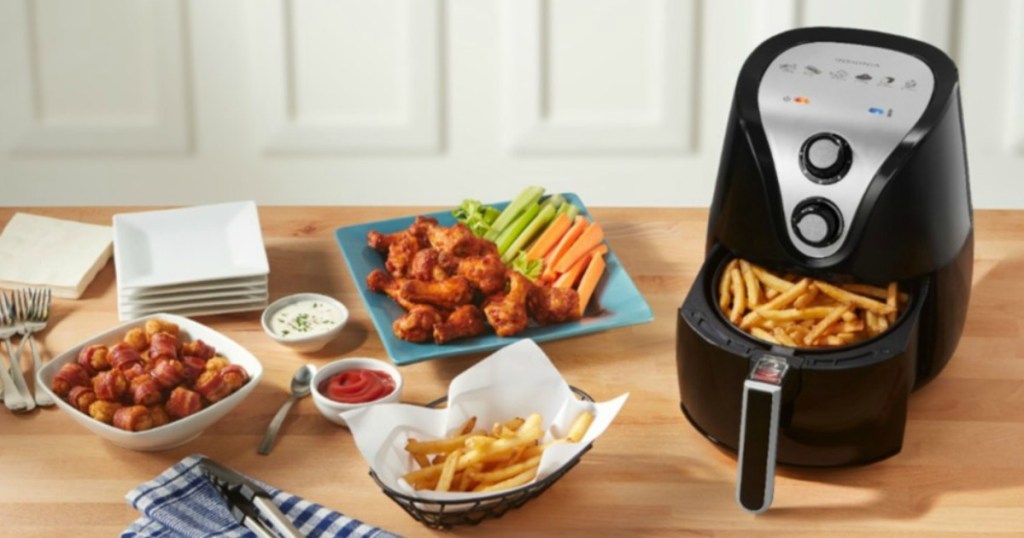 Insignia Air Fryer on table with food