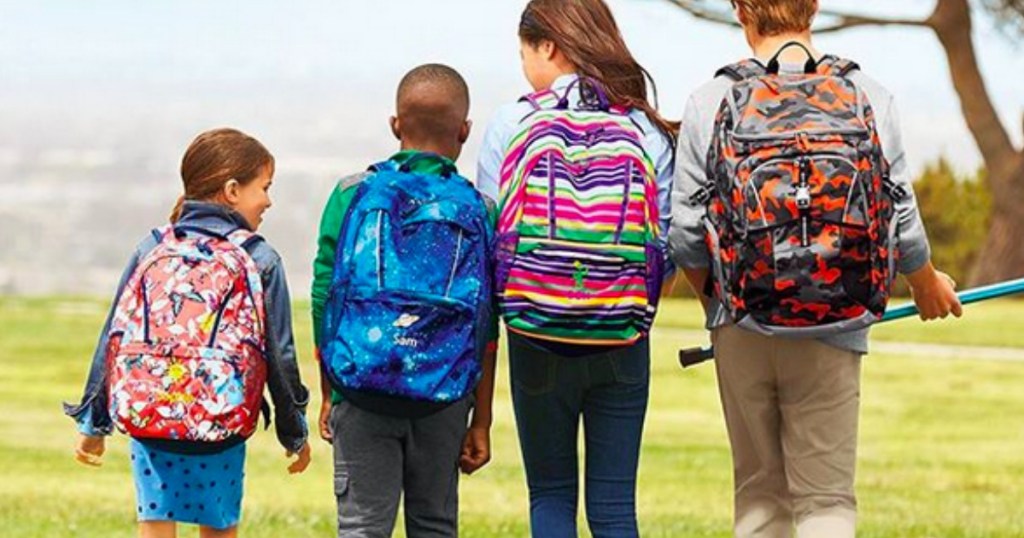 kids lined up next to each other wearing lands' end backpacks 