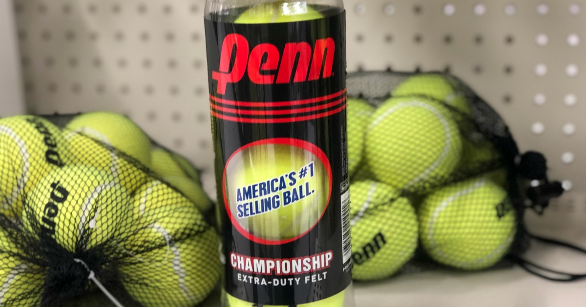 container of tennis balls with more tennis balls in bags