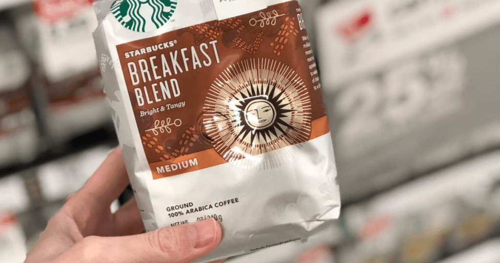 hand holding starbucks breakfast blend ground coffee
