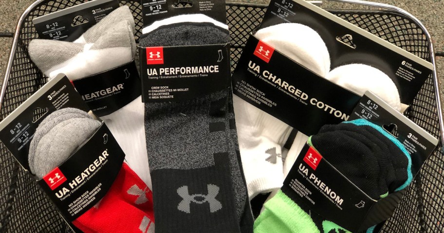 in-store basket of Under Armour socks packs