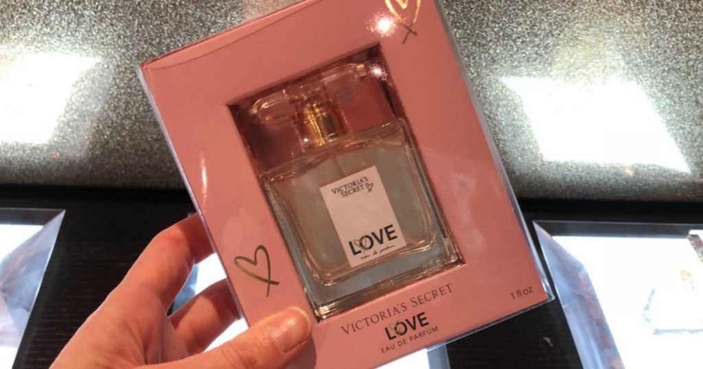 Hand holding Victoria's Secret Parfum