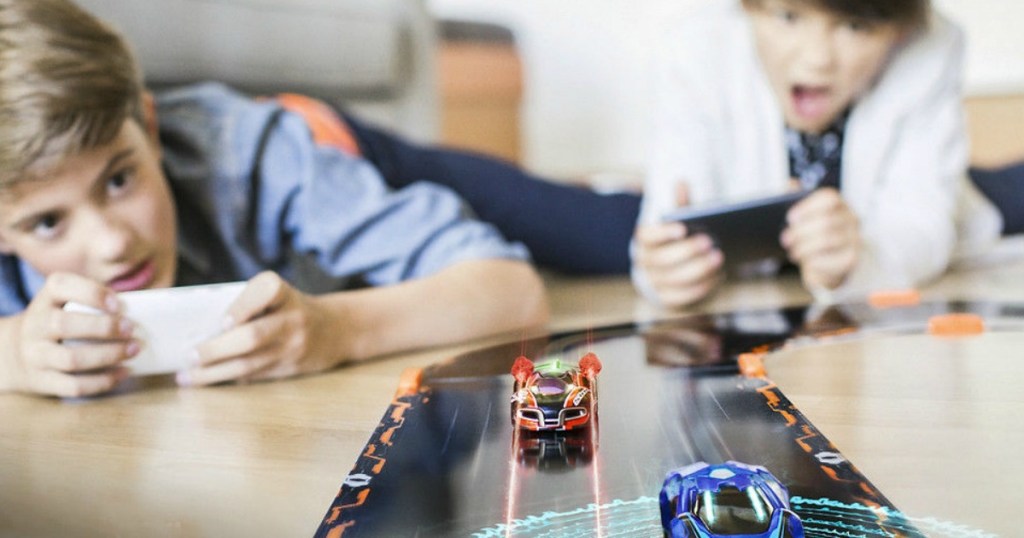 boys playing with Anki Overdrive set