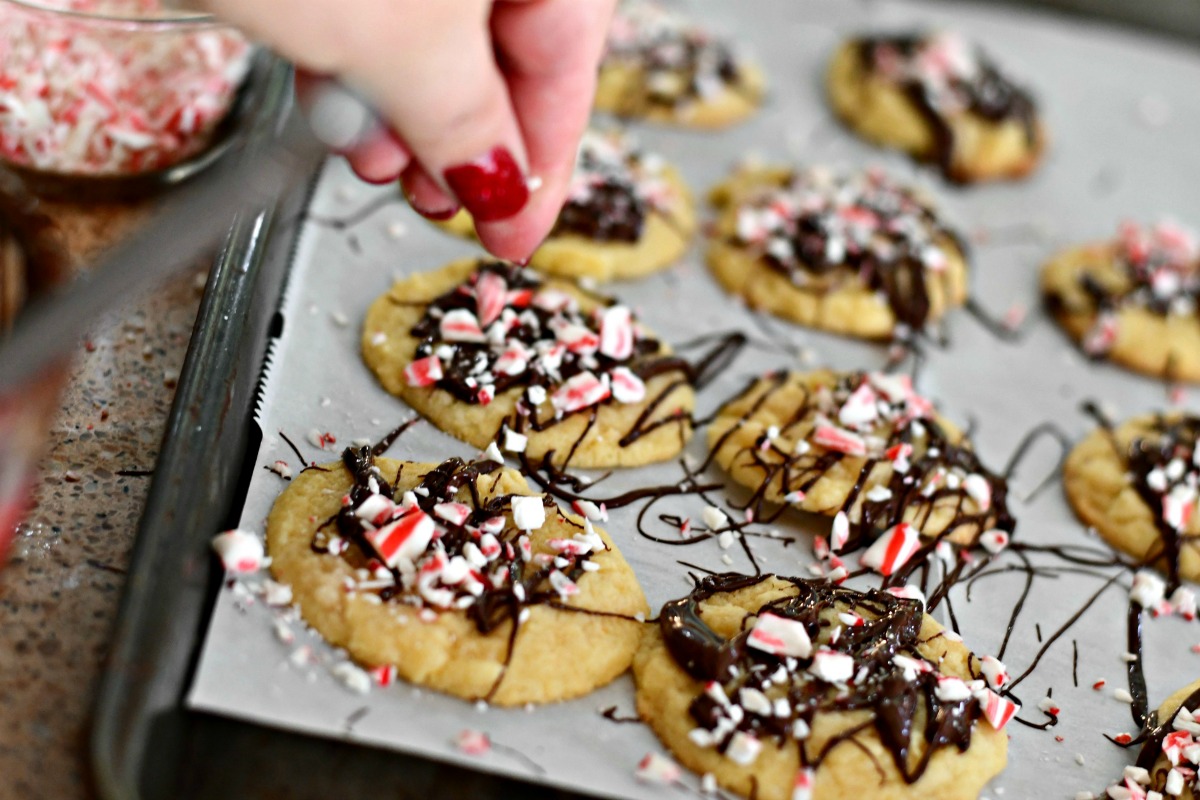 cookie dough christmas cookies recipe – peppermint chocolate drizzle cookies on a cookie sheet