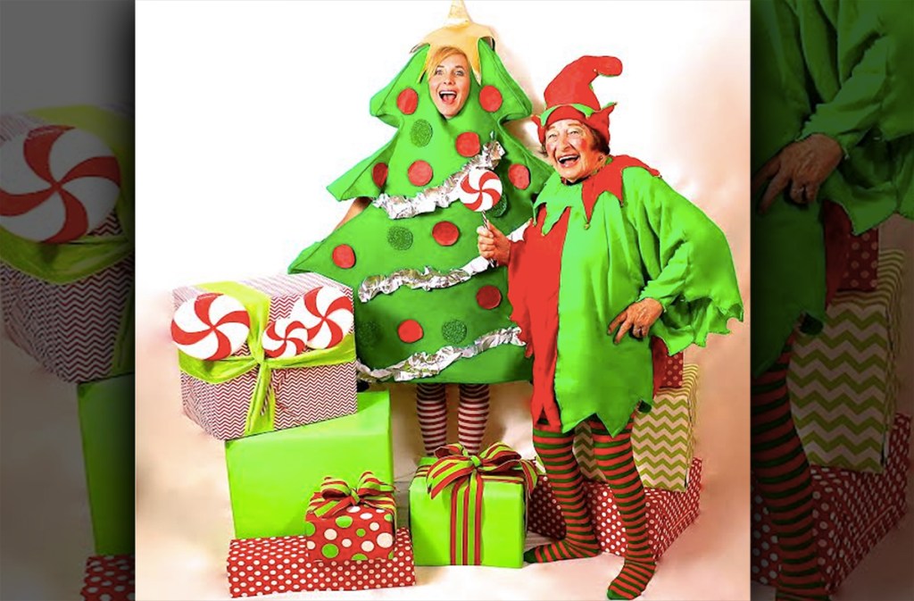 collin wearing christmas tree costume and ma in elf suit with christmas presents