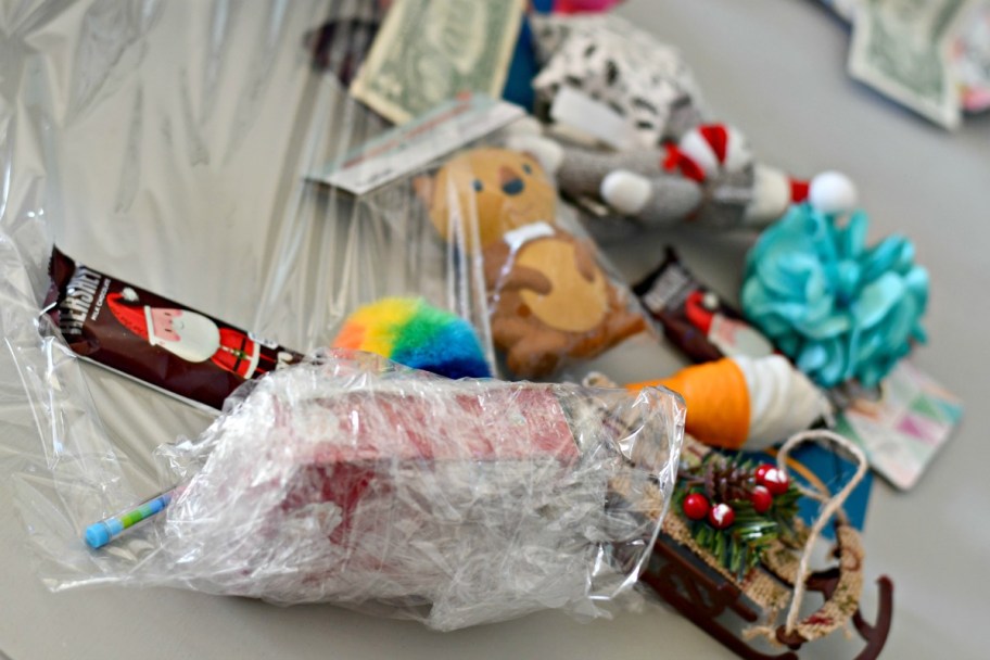 toys wrapped in plastic as part of an easy holiday activity for families