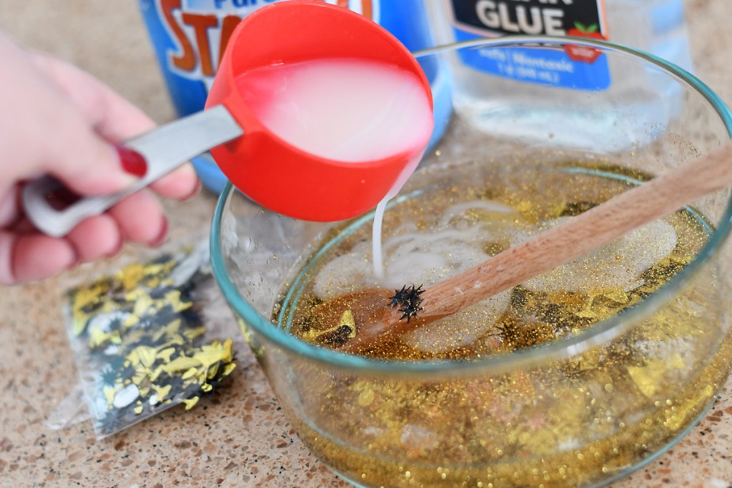 pouring liquid starch into New Year's Eve slime