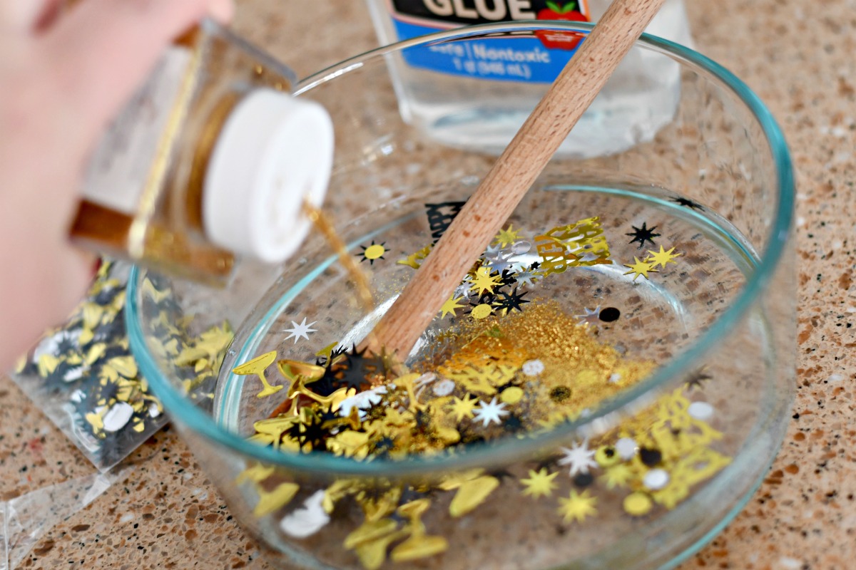 adding glitter to the New Year's Eve slime