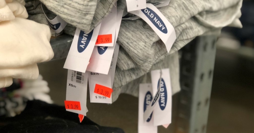 pile of Old Navy clothing with clearance tags