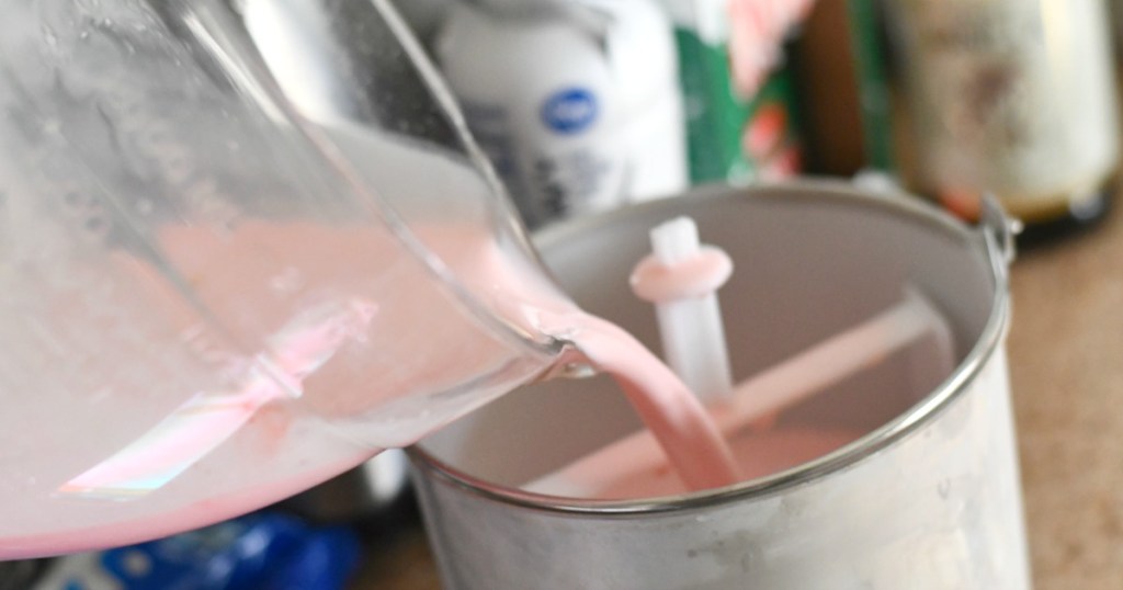 peppermint ice cream ingredients being poured into maker