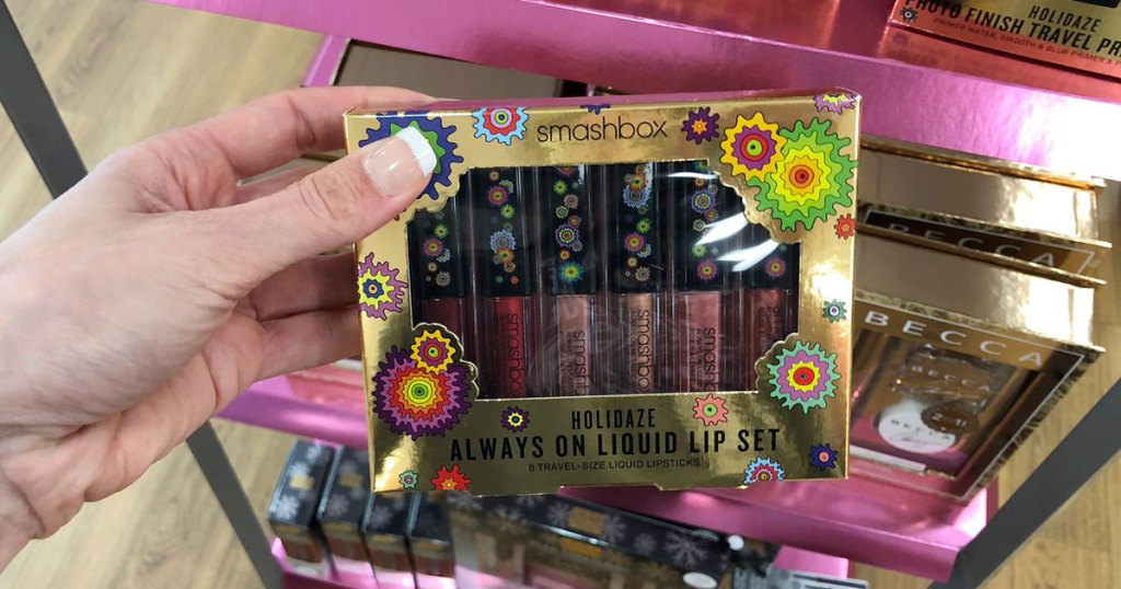hand holding smashbox makeup in store