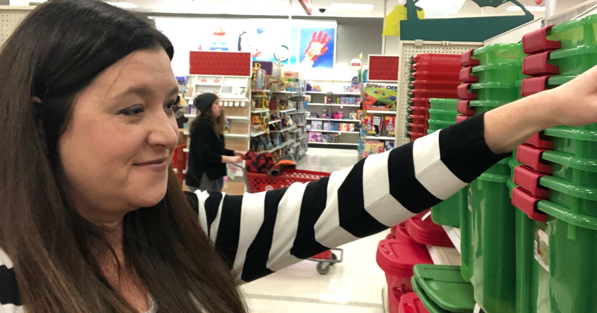 woman looking at Christmas storage bins in Target