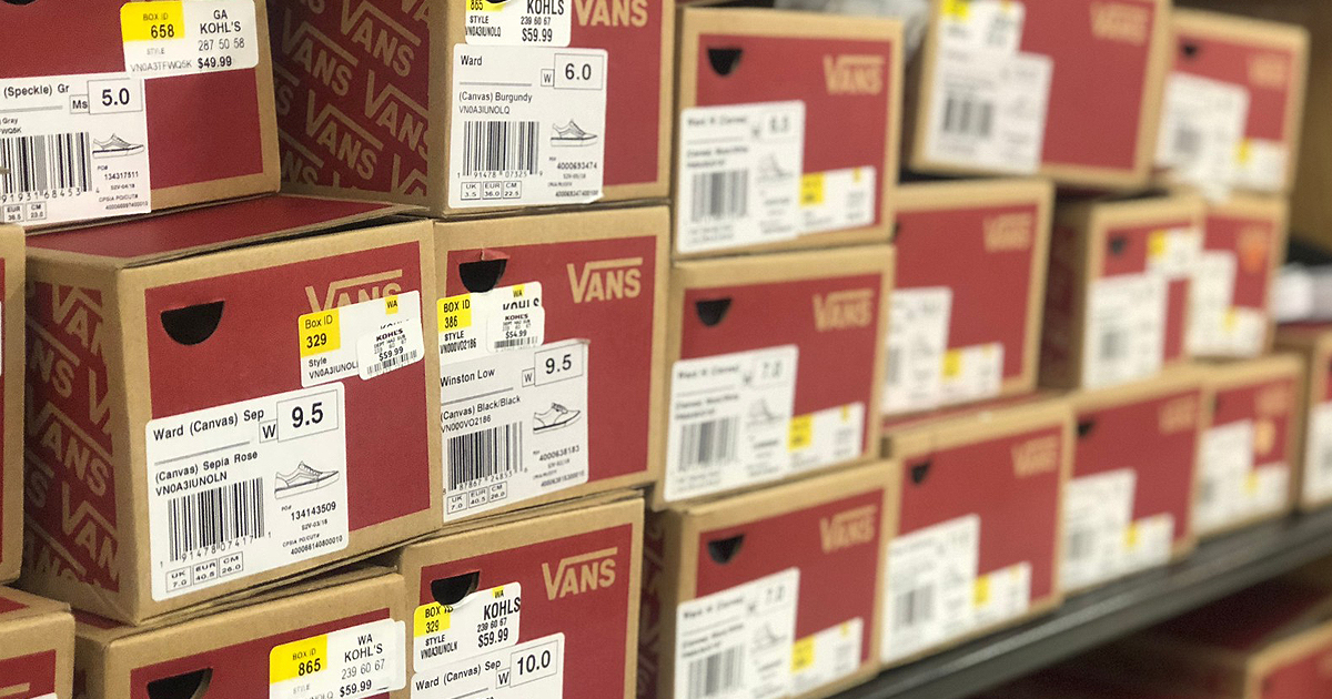 boxes of Vans shoes on a store shelf